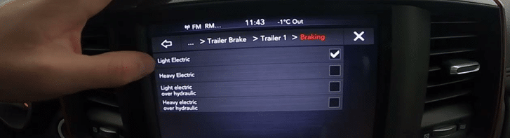 Vehicle dashboard showing trailer brake settings, including Light Electric and Heavy Electric options.