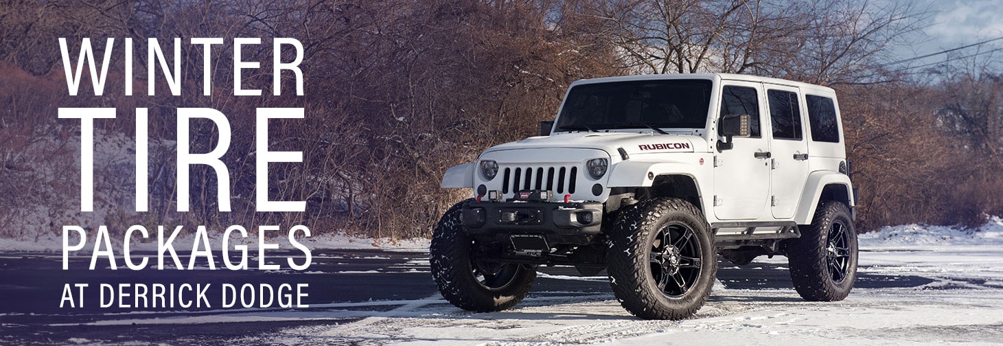 White Jeep in snowy landscape promoting winter tire packages at Derrick Dodge.